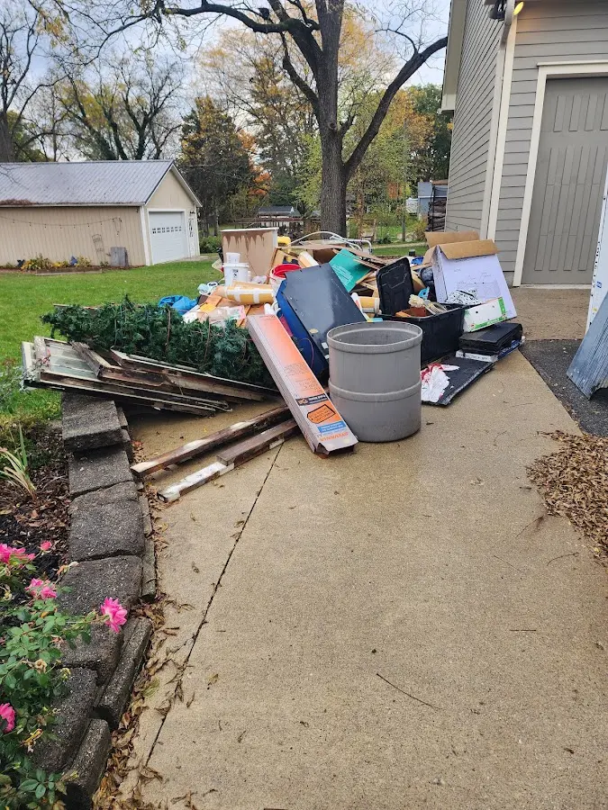 Dumpster being loaded with debris for 3 Yard Dumpster Rental in Centreville